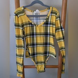 Yellow plaid body suit.